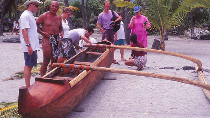 people surronding a caneo preparing for launch